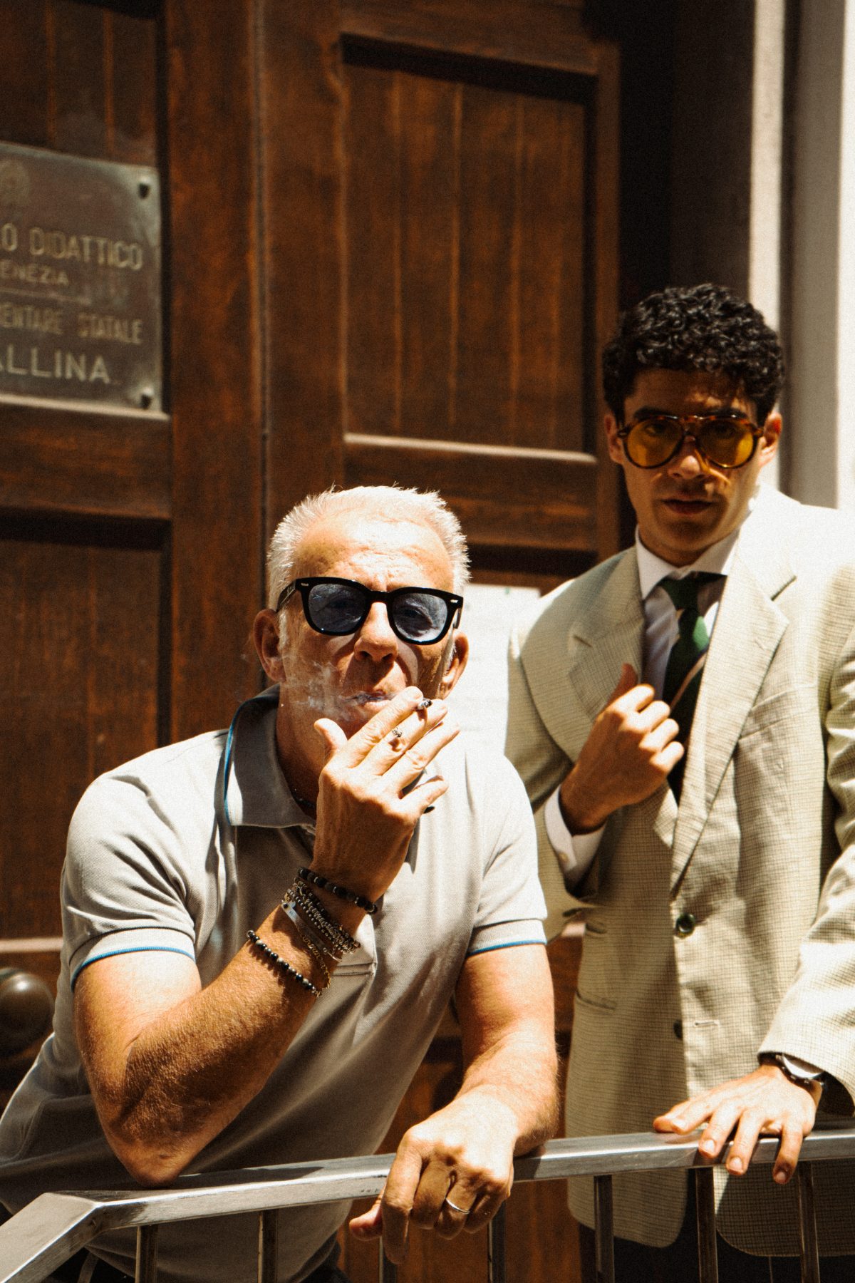A Venetian local smoking beside one of the models